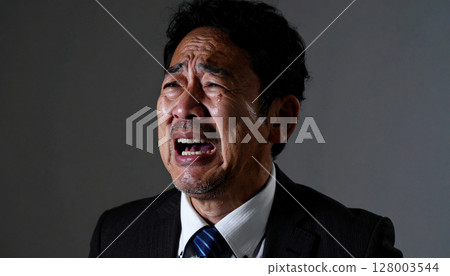 Crying businessman (AI generated image) 128003544