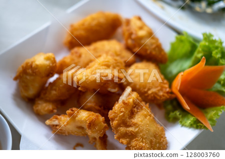 Fried shrimp served on plate with vegetable 128003760
