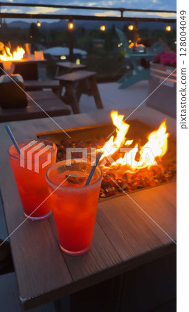 Sunset Cocktails by the Fire Pit at a Rooftop Lounge 128004049