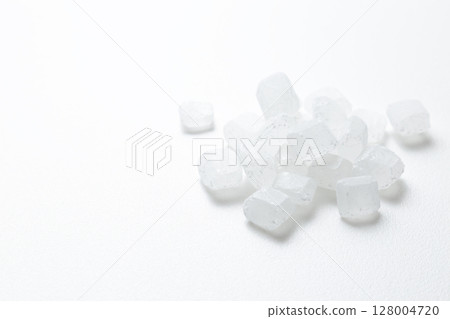 Rock sugar on white background Rock sugar on white background 128004720