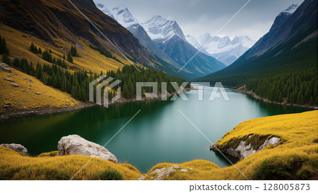 A natural view with a river and high mountains as a background during twilight. 128005873