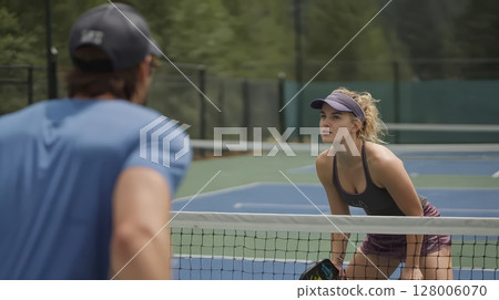 couple playing pickleball romantically 128006070