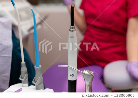 Exploring modern dental technology in a bright clinic during a routine checkup with focused professionals and advanced tools enhancing patient care Exploring modern dental technology in a bright clinic during a routine checkup with focused professionals and advanced tools enhancing patient care 128006905