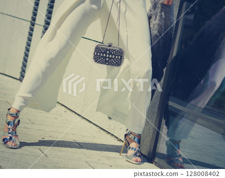 Woman wearing high heels and culottes 128008402