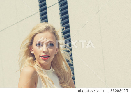 Blonde woman in city 128008425