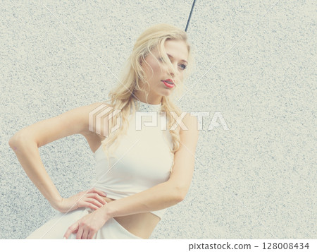 Blonde woman in city 128008434