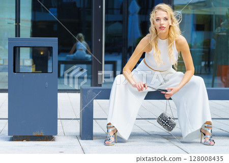 Woman wearing crop top and culottes Woman wearing crop top and culottes 128008435
