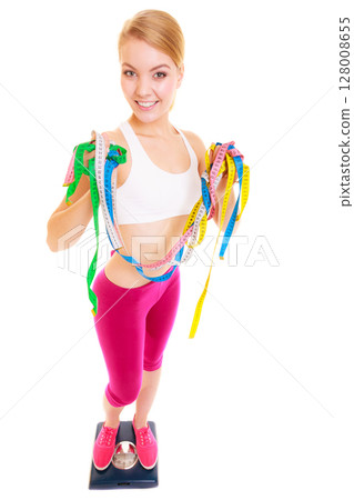 Happy woman on weighing scale. Slimdown. Happy woman on weighing scale. Slimdown. 128008655