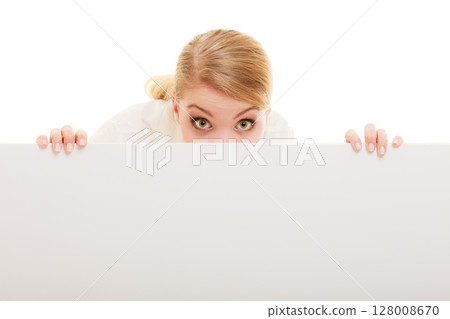 Businesswoman hiding behind blank copy space banner Businesswoman hiding behind blank copy space banner 128008670
