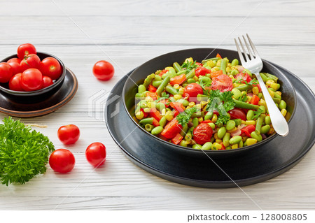 succotash of corn, beans, tomatoes, in black bowl 128008805