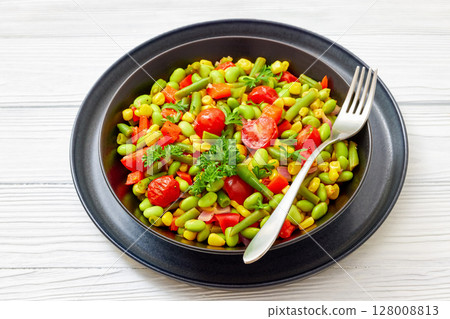 succotash of corn, beans, tomatoes, in black bowl 128008813