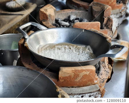 Traditional Thai Street Dessert Making on Charcoal Stove 128009110