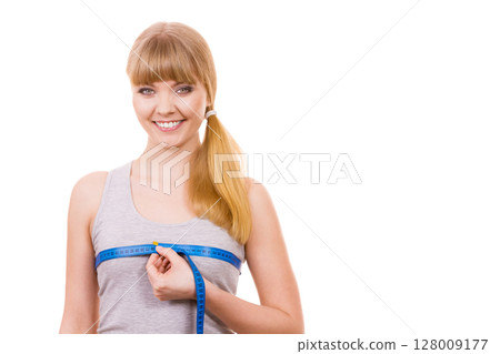 woman measuring her chest breasts isolated 128009177