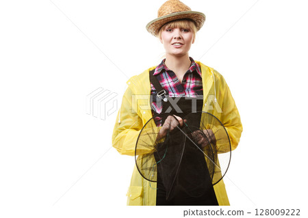 Happy woman holding empty fishing keepnet 128009222