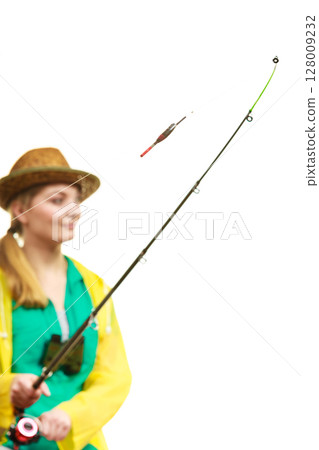 Woman with fishing rod , spinning equipment 128009232