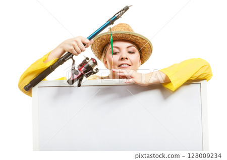 Happy woman with fishing rod holding board 128009234
