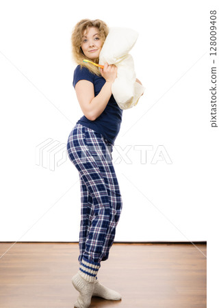Happy cheerful woman wearing pajamas Happy cheerful woman wearing pajamas 128009408