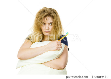 Goofy woman having morning bad mood 128009410