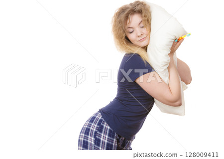 Sleepy woman hugging white pillow Sleepy woman hugging white pillow 128009411