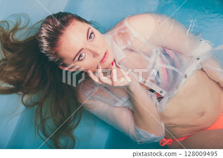 Sexy seductive woman in water. Sexy seductive woman in water. 128009495