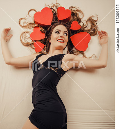 Woman in lingerie in bed. Valentines day love. 128009525