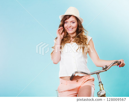 Woman with bike. Summer fashion and recreation. 128009567