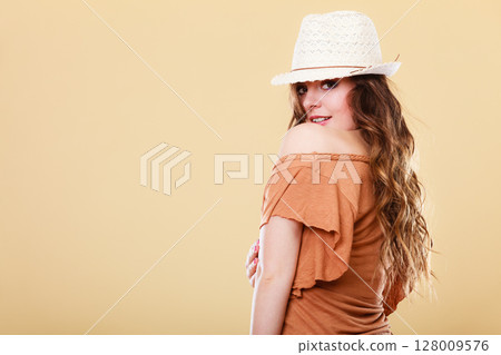 Lovely girl in summer clothes bright straw hat Lovely girl in summer clothes bright straw hat 128009576