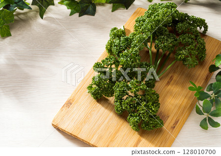 Fresh parsley to add color to dishes stock photo Fresh parsley to add color to dishes stock photo 128010700