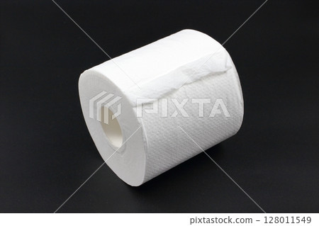 Toilet paper on a black background Toilet paper on a black background 128011549