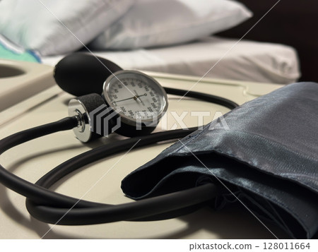 Manual Blood Pressure Cuff on Hospital Table Manual Blood Pressure Cuff on Hospital Table 128011664