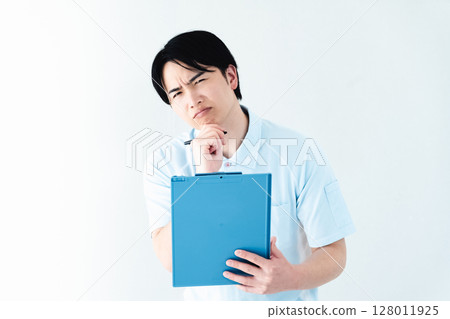 A man working as a caregiver holding a file 128011925