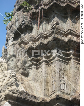Devata statue carved in the shrine of Angkor Wat Devata statue carved in the shrine of Angkor Wat 128012668