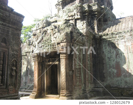 The gate of Ta Prohm, decorated with reliefs The gate of Ta Prohm, decorated with reliefs 128012679