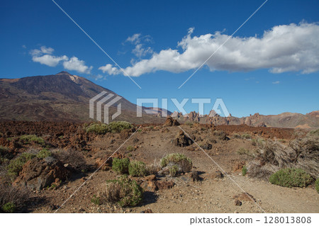 Volcanic landscape area next to a large mountain Volcanic landscape area next to a large mountain 128013808