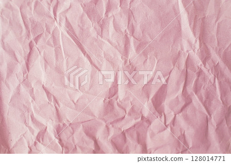 Pink crumpled paper background. Texture of crumpled paper, top view, copy space. 128014771