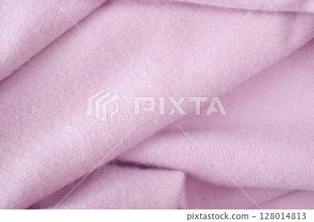 Cashmere pink stole. Texture, background, drapery. Fabric made of natural wool and silk, pastel pink color. 128014813