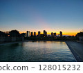 Outdoor pool sunset 128015232