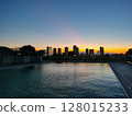 Outdoor pool sunset 128015233