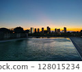 Outdoor pool sunset 128015234