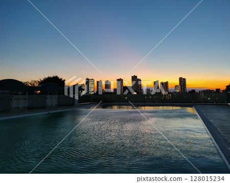 Outdoor pool sunset 128015234