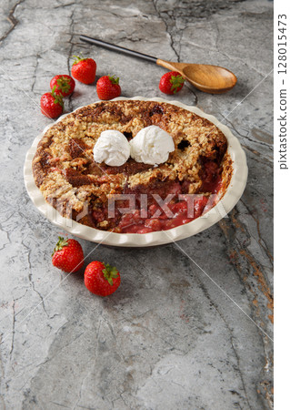 Summer delicious Chocolate strawberry cobbler with ice cream close-up in baking dish. Vertical 128015473