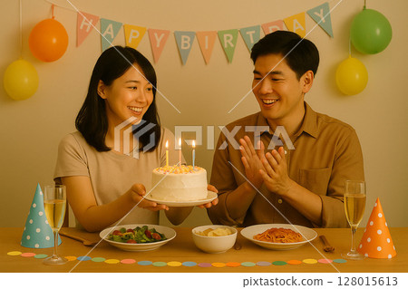 Smiling couple celebrating a birthday with a homemade cake 128015613