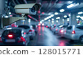 Security camera monitoring heavy traffic on a busy city street during rush hour. 128015771