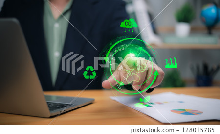 Person with glowing green holographic earth and eco icons for sustainability and green business 128015785