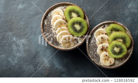 Two Bowls of Chia Seed Pudding with Kiwi and Banana 128016592