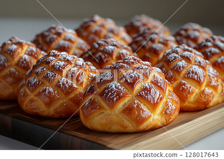 Baking. Christmas buns in the shape of a pine cone in on a wooden trading tray on a white background. 128017643