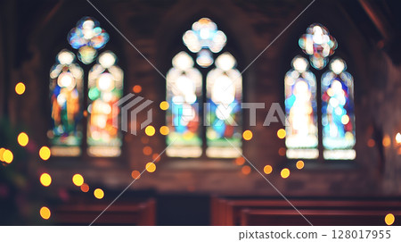 Stained glass windows adorned with warm lights in a serene church during a quiet evening Stained glass windows adorned with warm lights in a serene church during a quiet evening 128017955