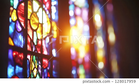 Colorful stained glass windows illuminating a church interior during the afternoon light 128017959