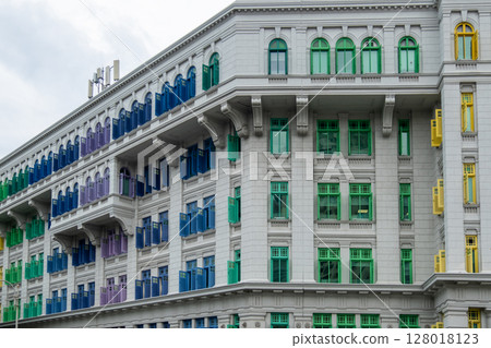 Colorful rainbow window of the Old Hill Street Police Station near Clarke Quay, Singapore. 128018123