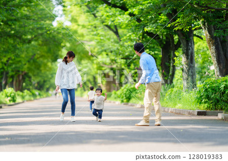 Boy running towards family 128019383